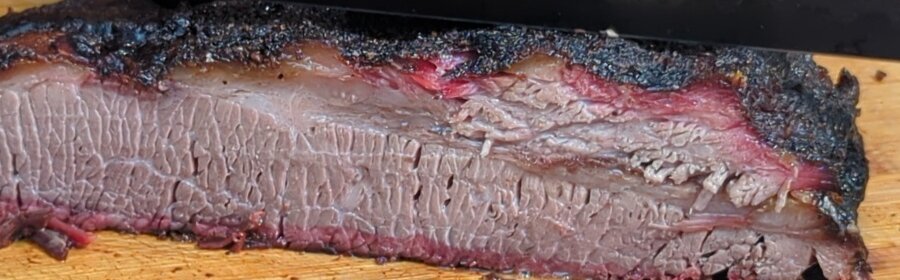 How To Smoke Brisket In 4 Easy Steps For Beginners How To Smoke Brisket In 4 Easy Steps For Beginners slicing brisket on zgrills image